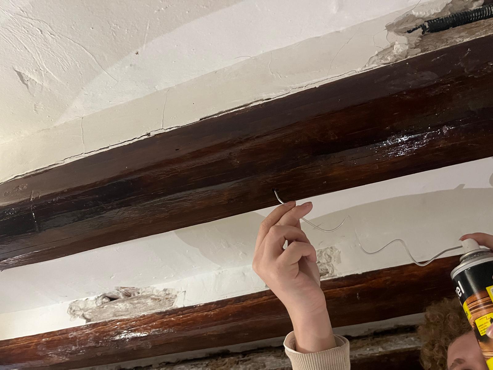 Aplicación de tratamiento protector en viga