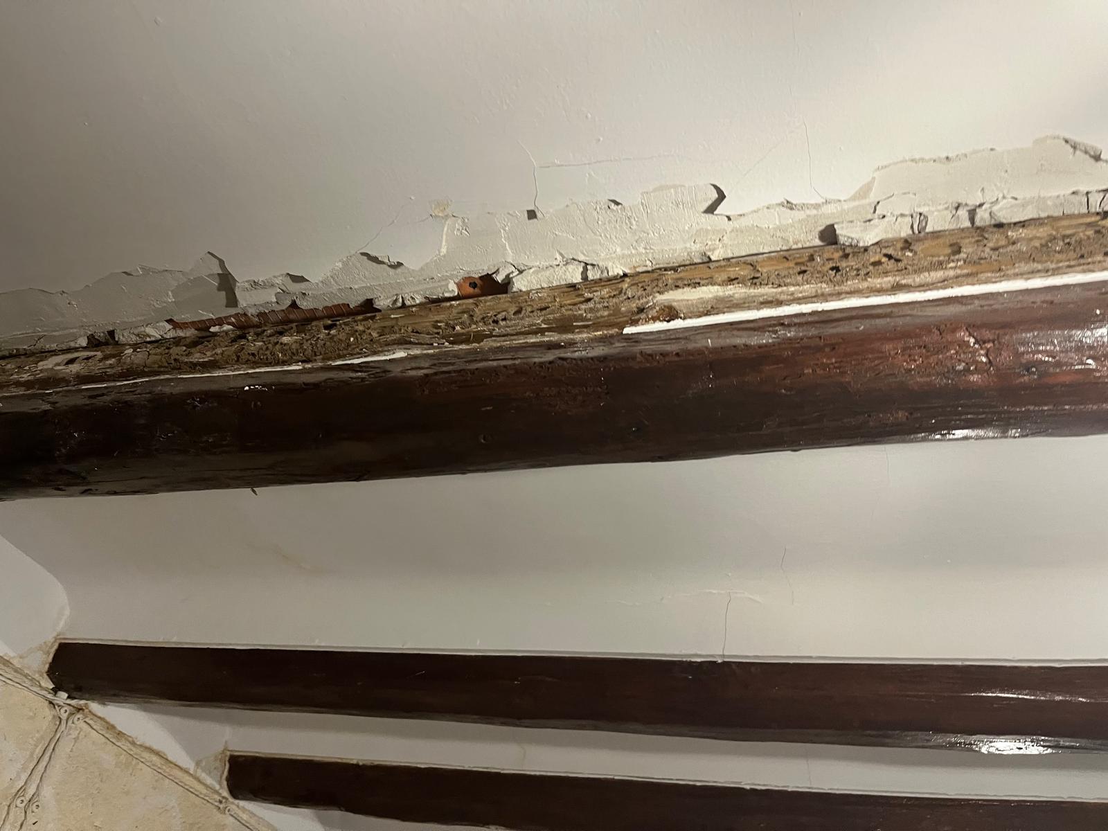 Viga combada por sobrecarga